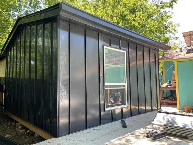 Black standing seam metal wall panels for Roof Inspection in Ferry Pass