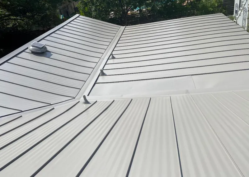 Solar attic fan installed on a metal roof for Roof Ventilation in Ferry Pass
